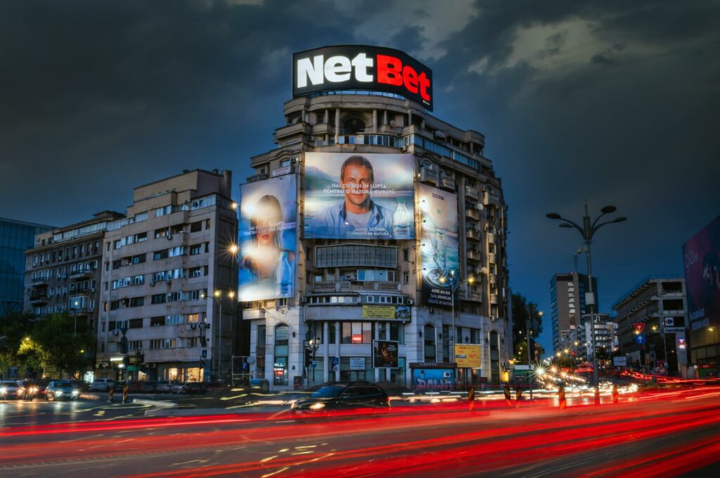 spectacular advertising: combination of illuminated advertising on rooftop and giant advertising banners in  Bucharest, Romania