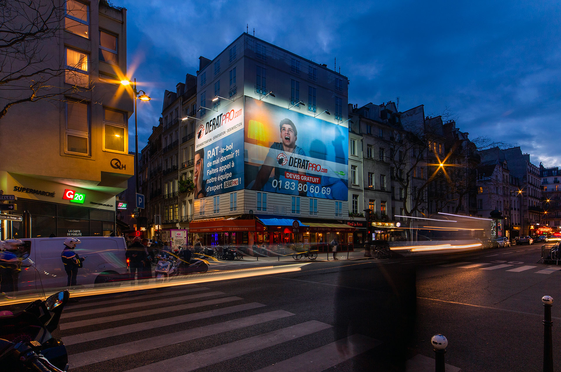 Giant advertising banner for Deratpro in Paris
